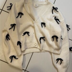 White Sweater with Black Bow Accents